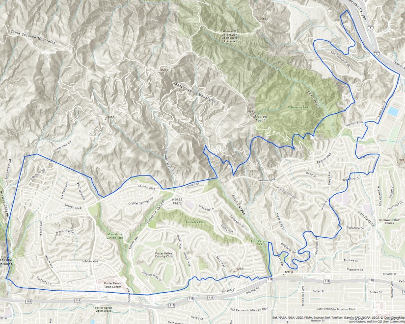 Topographic map showing the Porter Ranch and Granada Hills areas of Los Angeles, California. The map is overlaid with a bold blue boundary line outlining a specific region, which includes residential neighborhoods, hillside terrain, and portions of Porter Ranch, Porter Valley Country Club, Aliso Canyon, and the Mission Point area. 