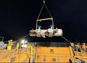 LADWP crews lower a new pipe section with two valves into place as part of an infrastructure upgrade in the Granada Hills area.